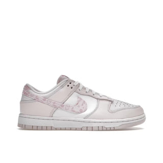 A pair of Nike Dunk Low Paisley Pack Pink sneakers designed for women. The shoes feature a vibrant pink paisley pattern on the upper, with white laces and a white Nike swoosh on the sides. The midsole is white, while the outsole is pink. The sneakers are displayed against a clean white background.