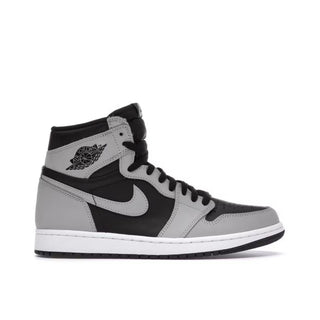 Jordan 1 Retro High Shadow 2.0. Gray and black high-top sneaker with Nike logo on a white background