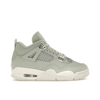 Jordan 4 Retro Seafoam (W). Light teal sneaker with off-white sole on a white background