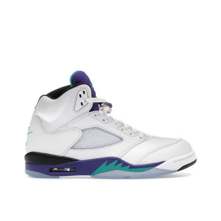 Jordan 5 Retro Grape. White sneaker with purple and green accents on a white background